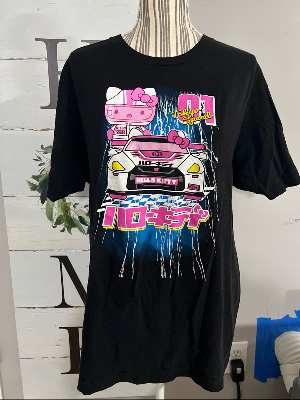 Hello Kitty Black Tee with Pink and Blue Racing Graphic